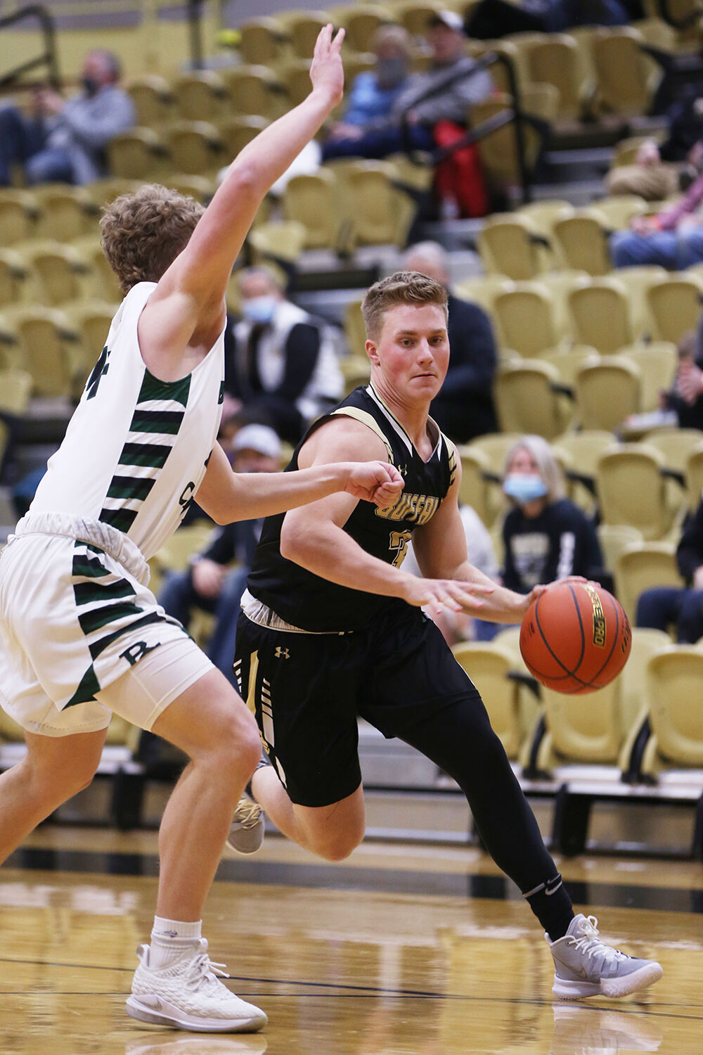 Hyrum Hatch drives toward the basket during the first quarter